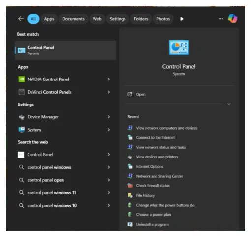 หน้าจอผลการค้นหาของ Windows ธีมมืด แถบบนมีตัวกรอง All, Apps, Documents, Web, Settings, Folders, Photos หัวข้อ Best match แสดงผลลัพธ์อันดับหนึ่งคือ Control Panel ประเภท System ซึ่งถูกไฮไลต์ ถัดลงมาหัวข้อ Apps มี NVIDIA Control Panel และ DaVinci Control Panels หัวข้อ Settings มี Device Manager และ System หัวข้อ Search the web มีคำค้นหลายบรรทัด ด้านขวาเป็นการ์ดพรีวิวของ Control Panel พร้อมปุ่ม Open และรายการ Recent เช่น View network computers and devices, Network and Sharing Center, Check firewall status